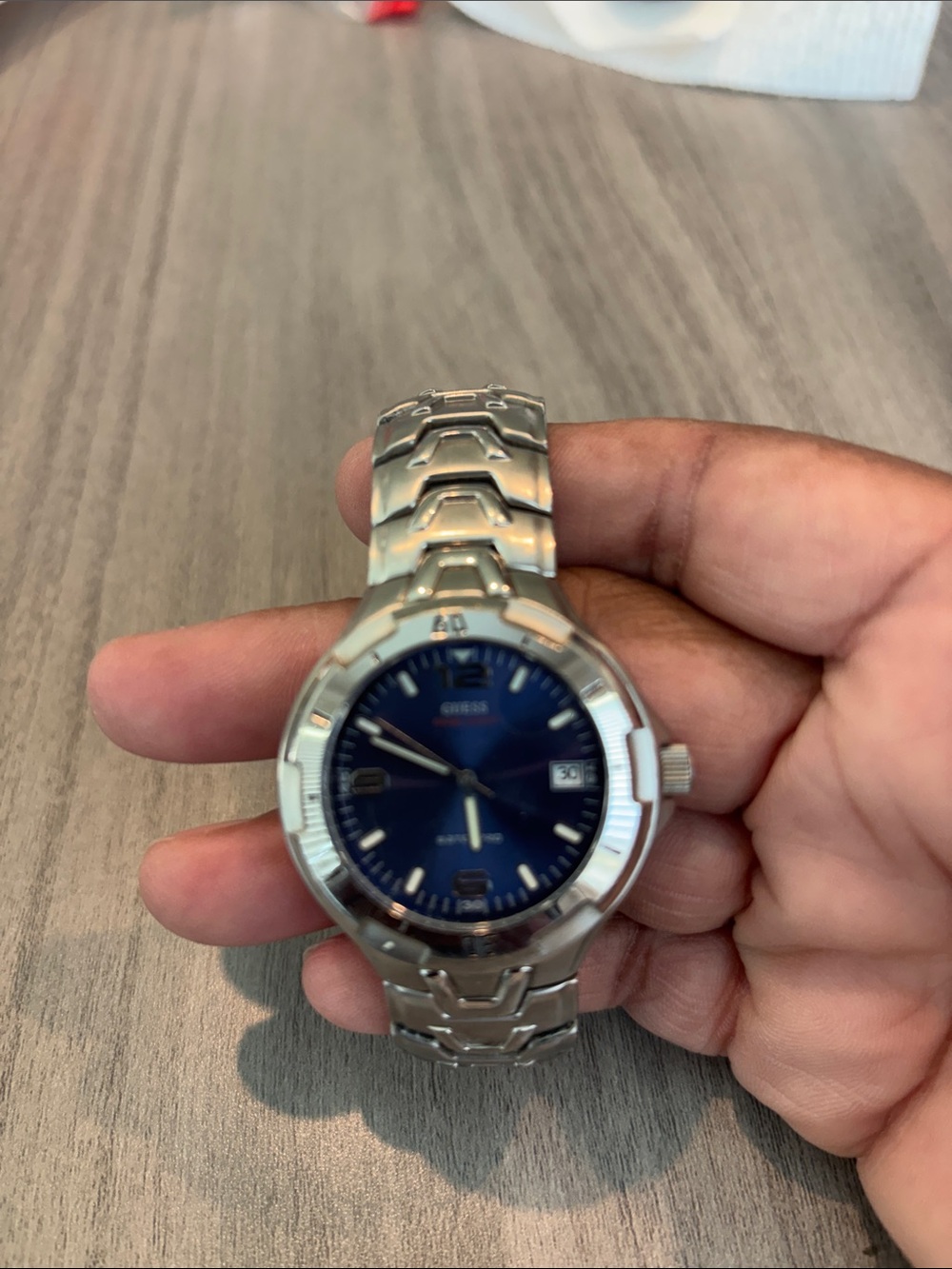 Guess Men’s Silver Watch with Blue Dial. (Will need battery)
